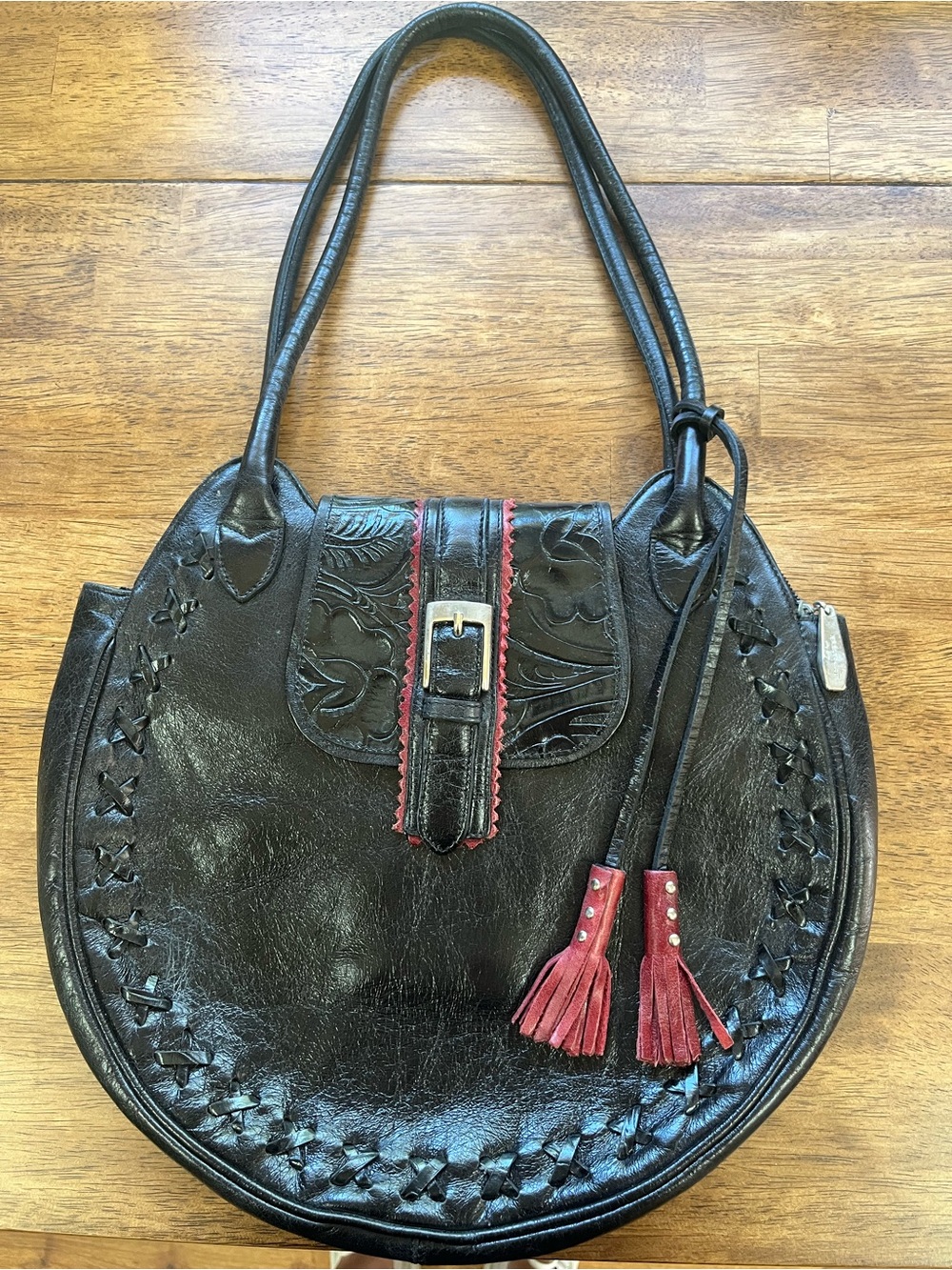 Berge Black Leather Shoulder Bag with Red Tassel Accents